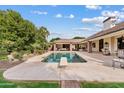 Refreshing swimming pool and diving board, surrounded by a lush backyard, ideal for outdoor entertaining at 4222 E Brown Rd # 18, Mesa, AZ 85205