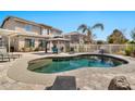 Backyard features a refreshing pool, gazebo, and ample seating, ideal for outdoor relaxation and entertaining at 5110 S Sandstone St, Gilbert, AZ 85298