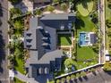 Aerial view showcasing the expansive property featuring a pool, hot tub, backyard, and manicured landscaping at 5144 E Calle Del Medio --, Phoenix, AZ 85018