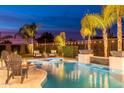 Backyard oasis with a sparkling pool, spa, and fire pit, perfect for entertaining at 5904 E Calle De Las Estrellas Rd, Cave Creek, AZ 85331