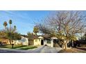 This charming house features a well-manicured lawn, desert landscaping, and a two-car garage at 6325 N 83Rd Pl, Scottsdale, AZ 85250