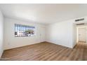 Bright living room with sleek flooring and a large window, creating a welcoming space at 737 W Jones Ave, Phoenix, AZ 85041