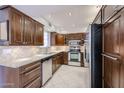 Beautiful kitchen with stainless steel appliances, elegant cabinetry, and a modern tiled backsplash at 7800 E Lincoln E Dr # 1102, Scottsdale, AZ 85250