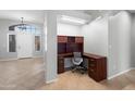 Bright entryway featuring a built-in desk and tiled floors at 10449 E Lomita Ave, Mesa, AZ 85209