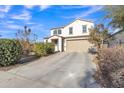 Charming two-story home with a spacious driveway and well-maintained landscaping at 1052 W Capulin Trl, San Tan Valley, AZ 85140