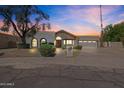 Lovely home with tiled roof, arched windows, and meticulously landscaped yard, creating instant curb appeal at 10540 N 78Th Pl, Scottsdale, AZ 85258