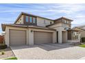 Beautiful two story home with a three car garage, covered entry, and well manicured lawn at 11679 W Parkway Ln, Avondale, AZ 85323