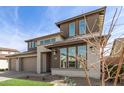 Stylish two-story home featuring a three-car garage, low-maintenance landscaping, and attractive curb appeal at 11679 W Parkway Ln, Avondale, AZ 85323