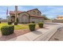 Lovely two-story home with landscaped front yard and three-car garage at 12443 W Monte Vista Rd, Avondale, AZ 85323