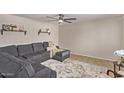 Comfortable living room features decorative shelving and a plush sectional sofa at 1310 S Pima St # 34, Mesa, AZ 85210