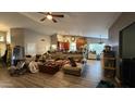 Open-concept living room, showcasing wood-look flooring and a cozy atmosphere at 14440 N 56Th Pl, Scottsdale, AZ 85254