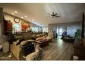 Spacious living room featuring vaulted ceilings, wood floors and ample natural light at 14440 N 56Th Pl, Scottsdale, AZ 85254