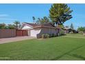 Spacious home with a large backyard, a private gate, and a well-maintained lawn for outdoor enjoyment at 1509 W Kiowa Ave, Mesa, AZ 85202