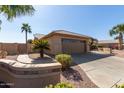 Attractive single-story home boasts a desert landscape and a convenient two-car garage at 15479 W Whitton Ave, Goodyear, AZ 85395