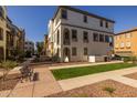 This is a beautiful townhome with lush green grass and an inviting walkway at 1677 E Bridgeport Pkwy, Gilbert, AZ 85295