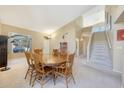 Spacious living room area featuring tall ceilings, neutral paint, and large staircase at 17036 N 43Rd Pl, Phoenix, AZ 85032