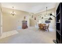 Open-concept living room with high ceilings, neutral colors, and large windows allowing natural light at 17036 N 43Rd Pl, Phoenix, AZ 85032