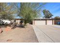 Inviting single-story home with a drought resistant front yard and two-car garage at 19013 N 18Th Ave, Phoenix, AZ 85027