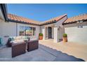 Charming patio with comfortable seating, perfect for enjoying the desert weather and outdoor living at 21614 N 138Th Ave, Sun City West, AZ 85375