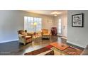 Inviting living room featuring two cozy chairs, lamp, and natural light at 2168 E Vista Bonita Dr, Phoenix, AZ 85024