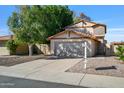 Two-story home with a well-maintained yard and a two-car garage at 2706 W Estrella Dr, Chandler, AZ 85224