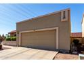 Inviting home featuring a two car garage, a tile roof, and low maintenance desert landscaping at 2848 E Brown Rd # 30, Mesa, AZ 85213