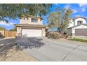 Charming home featuring a well-maintained lawn, mature landscaping, and an attached two-car garage at 3906 N 297Th Cir, Buckeye, AZ 85396