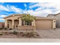 Inviting single-Gathering home with landscaped front yard and a two-car garage offering curb appeal at 65 W Cucumber Tree Ave, San Tan Valley, AZ 85140