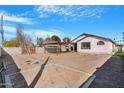 Spacious backyard featuring a patio structure, perfect for outdoor entertaining and relaxation at 7510 N 59Th Ln, Glendale, AZ 85301