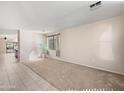 Bright and airy living room with tile and carpet flooring, perfect for relaxing or entertaining at 801 S 120Th Ave, Avondale, AZ 85323