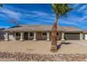 Charming single-story home featuring a desert landscaped yard with a neutral-colored facade and attached garage at 1318 E Mission Grande Ave, Casa Grande, AZ 85122