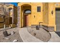 Charming home entrance with desert landscaping and stone accents at 19226 N Cave Creek Rd # 109, Phoenix, AZ 85024