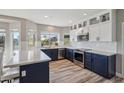 Modern kitchen featuring stainless appliances, white quartz counters and shaker cabinets at 19240 N 90Th Pl, Scottsdale, AZ 85255