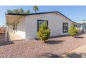 Well-maintained home with minimalist landscaping and a spacious carport area at 245 S 56Th St # 262, Mesa, AZ 85206