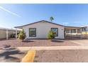 Cozy single-story home featuring a carport and desert landscaping for easy maintenance at 245 S 56Th St # 262, Mesa, AZ 85206