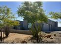 Contemporary home featuring desert landscaping and a two-car garage at 28304 N 141St Way, Scottsdale, AZ 85262