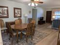 Bright dining area featuring wood table and neutral accents with view into Living Room at 459 S Boojum Way, Mesa, AZ 85208