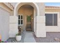 Inviting front entryway with decorative accents, a wreath, and desert landscaping at 9 W Glenhaven Dr, Phoenix, AZ 85045