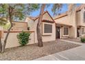 Inviting exterior view of this charming home with desert landscaping and a cozy entrance at 921 W University Dr # 1051, Mesa, AZ 85201