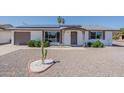 Attractive home featuring desert landscaping, and a cozy front porch at 11214 N 105Th Ave, Sun City, AZ 85351