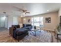 Comfortable living room with a large window and stylish decor at 11214 N 105Th Ave, Sun City, AZ 85351