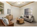 Bright living room with modern furnishings, complemented by neutral tones and a decorative area rug at 1126 W Elliot Rd # 1024, Chandler, AZ 85224