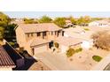 Charming home with a two-car garage, neutral color scheme, and well-maintained landscaping at 122 W Raven Dr, Chandler, AZ 85286