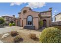 Inviting front yard with lush landscaping, gravel accents, and a cozy walkway at 22206 N 36Th Way, Phoenix, AZ 85050