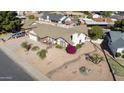 Well-kept single Gathering home with mature landscaping and traditional roof at 2558 E Inglewood St, Mesa, AZ 85213