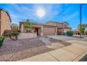 Charming single-story home with desert landscaping and a covered front porch at 379 W Dragon Tree Ave, Queen Creek, AZ 85140