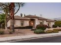 Charming single-story home with neutral paint, a tile roof, and mature landscaping at 3954 E Florian Ave, Mesa, AZ 85206