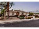 Charming single-story home with neutral paint, a tile roof, and mature landscaping at 3954 E Florian Ave, Mesa, AZ 85206