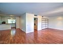 Spacious living room featuring hardwood floors, neutral walls, and ample natural light at 520 W Clarendon Ave # E18, Phoenix, AZ 85013