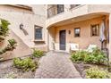 Private courtyard with stylish outdoor seating and manicured greenery at 5636 E Libby St, Scottsdale, AZ 85254